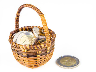 two euro coins in wicker basket