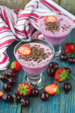 Smoothies. Milk dessert with cherries, strawberries and chocolat