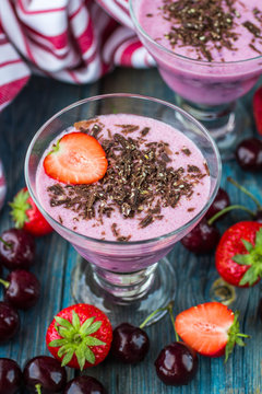 Smoothies. Milk dessert with cherries, strawberries and chocolat