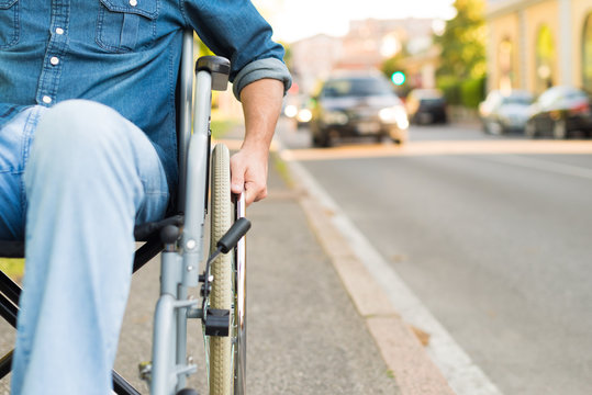 Man using his wheelchair in a city