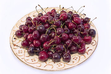 Cherries on the yellow plate
