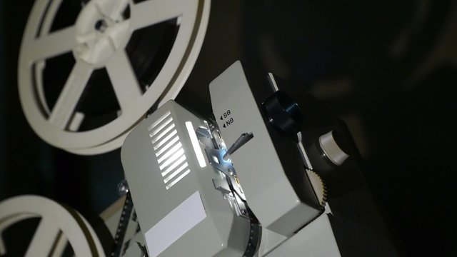 Vintage 8 Mm Movie Projector And Film Reel Closeup - Includes film projector audio