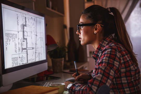 Young Female Architect Working At Home.