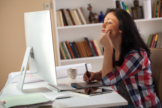 Female architect working at home.