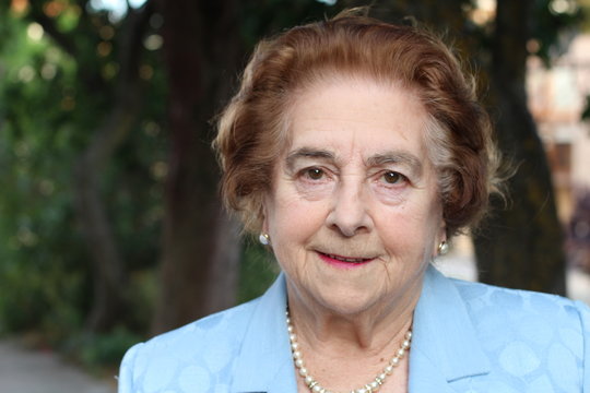 Elderly woman thinking about something in the fresh air