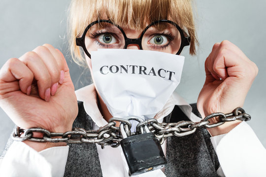 Furious woman with chained hands and contract
