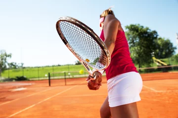 Foto op Canvas Young woman playing tennis © BalanceFormCreative