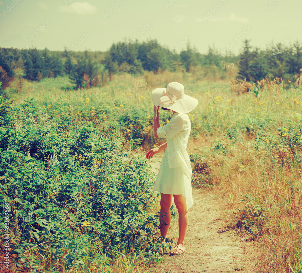 Poster beautiful girl walking in summer park