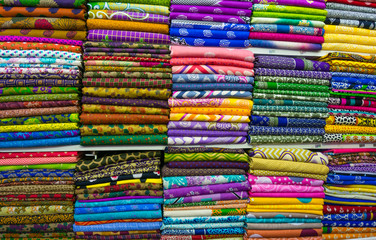 Pile of cloth fabrics at a local market in Bangladesh.