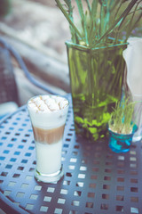Coffee cup on table in vintage retro color tone