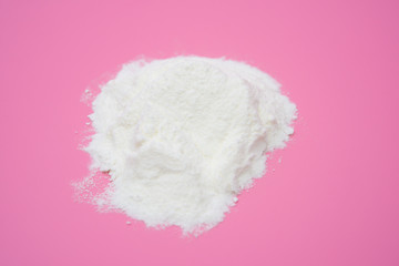 powdered milk on pink background