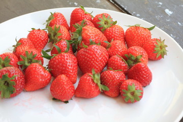 Sweet fresh stawberry on the wooden table, selective focus