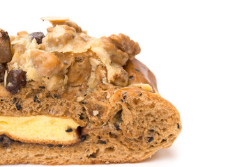 close up of healthy and yummy bread with walnut raisin and melon seed on white