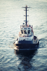 Tug boat underway, front view, tonal correction