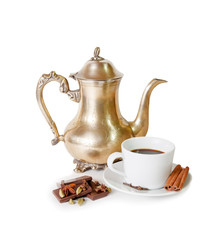 Coffee pot, cup of coffee with spices and pieces of chocolate is