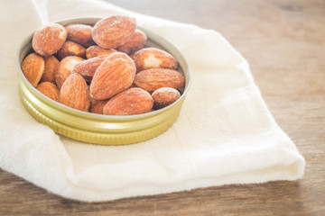 Almond grain roast salt on weathered wooden table