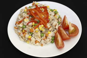 chicken risotto on a plate dark background