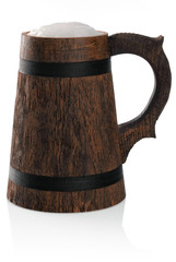 Wooden mug of fresh beer with foam cap isolated on white.