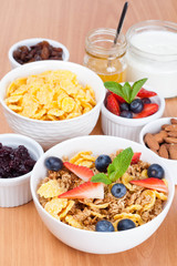 bowl of cornflakes with fresh berries and breakfast cereals