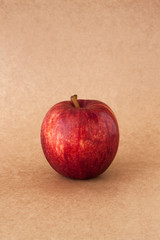 red apples on brown paper background 