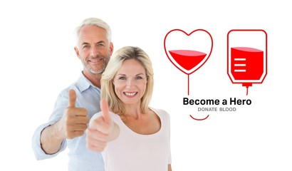 Composite image of smiling couple showing thumbs up together