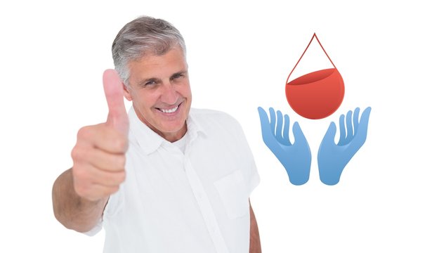 Composite image of casual man showing thumbs up at camera