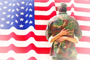 Obraz premium Composite image of army wife reunited with husband