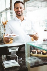 Smiling worker prepares orders 