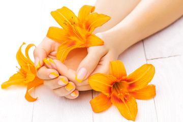 french manicure with orange lily. spa