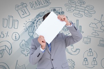 Composite image of businessman holding blank sign