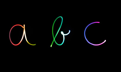 Fototapeta premium Flourescent letters 'abc' in different neon colors