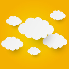 Paper clouds on orange background