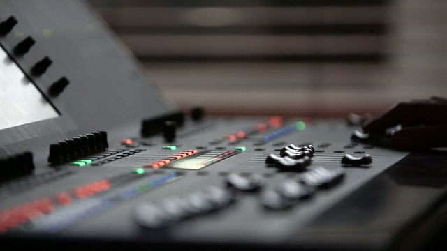 Man mixing sound at professional sound mixer.