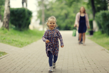 little girl for a walk in the park