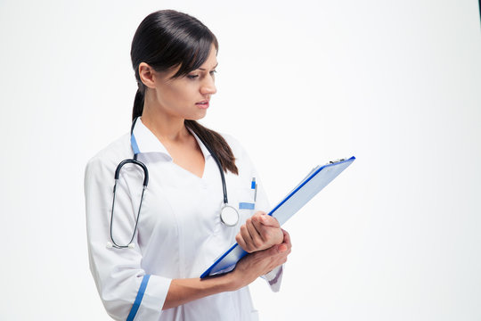 Beautiful Medical Doctor Reading Notes On Clipboard