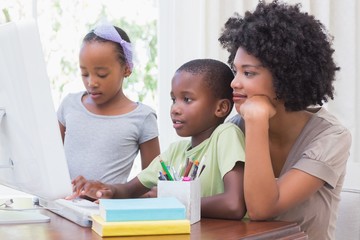 Happy family using the computer