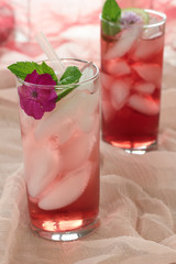 Glass of freshly prepared, cold and refreshing pomegranate drink.