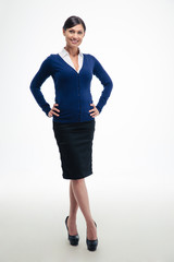 Fototapeta premium Full length portrait of a smiling young businesswoman