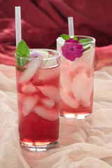 Glass of freshly prepared, cold and refreshing pomegranate drink.
