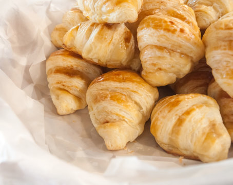 French croissants in white paper