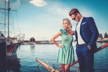 Fototapeta na wymiar Stylish wealthy couple on a luxury yacht