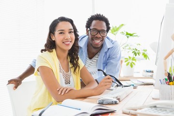 Portrait of smiling colleagues looking at camera