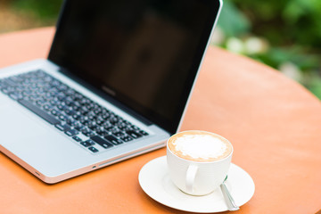Woman hands typing on laptop
