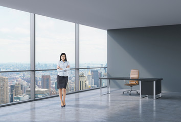 Full-length of brunette business lady in a workplace at modern corner panoramic office in New York, Manhattan. A concept of financial consulting services.