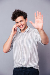 Fototapeta premium Smiling man talking on the phone