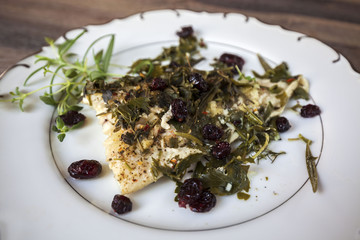 Cod with cranberries, thyme and rosemary