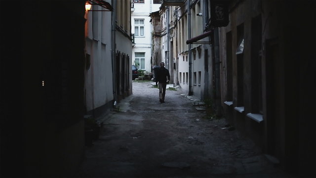 Night Eastern Europe. The young man goes on a night city.