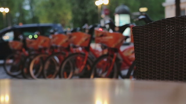 Rack of bikes in the city .Renting in Night Eastern Europe.
