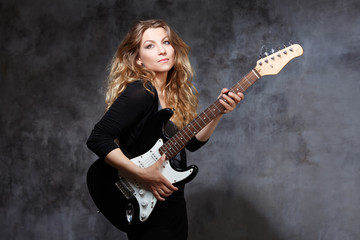 Fototapeta na wymiar beautiful blonde playing guitar
