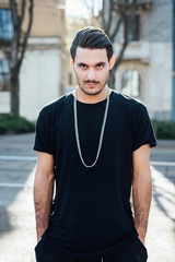 Young italian boy walking in the city